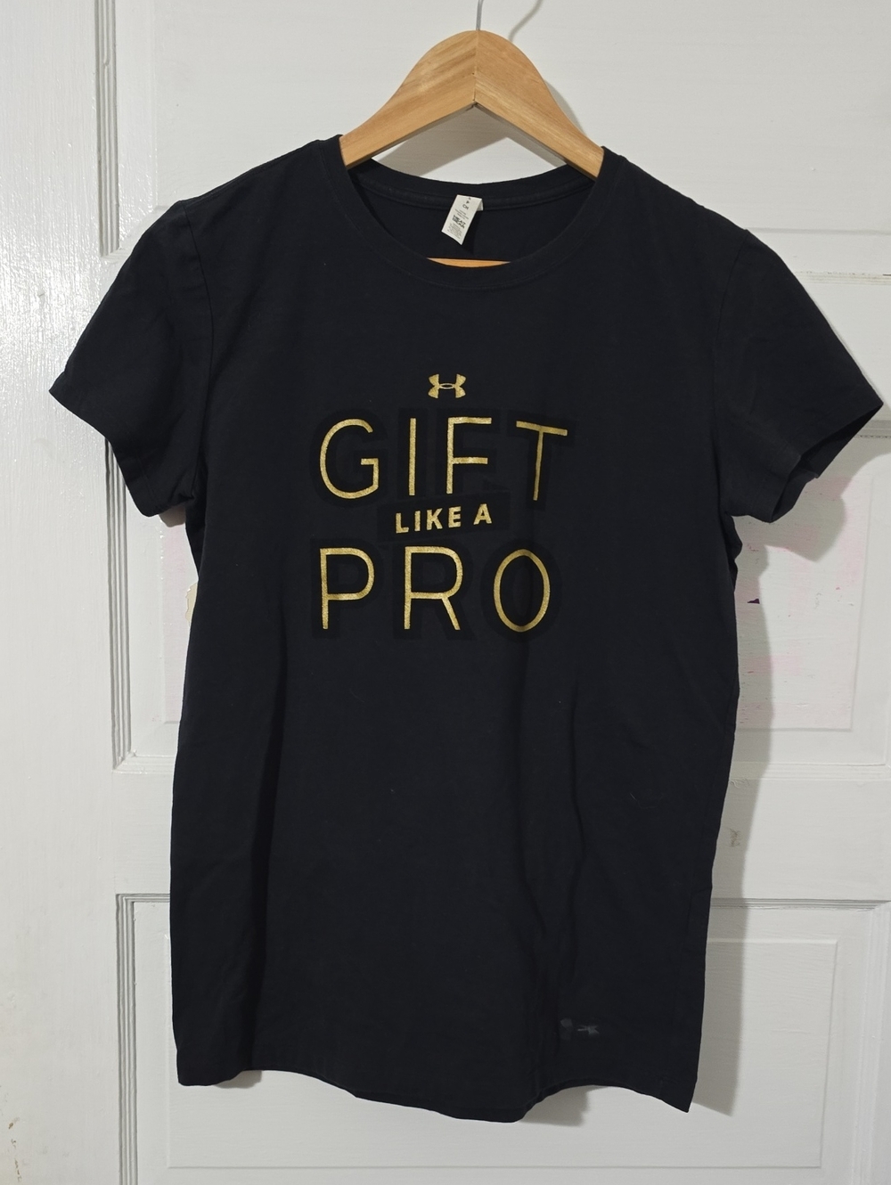Under Armour Black Short Sleeve Tee with Gold 'GIFT LIKE A PRO' Text